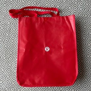 6 Lululemon shopping bags and 1 Athletica bag